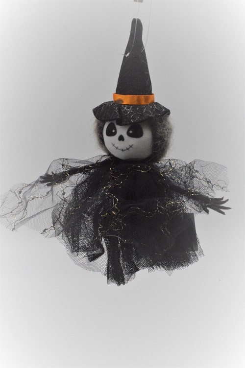 22103A - Small Halloween Witch hanging decoration with a  pointed hat and a Black sheer gold detailed shawl. Height 19cms , Width  15cms  (Approx) 