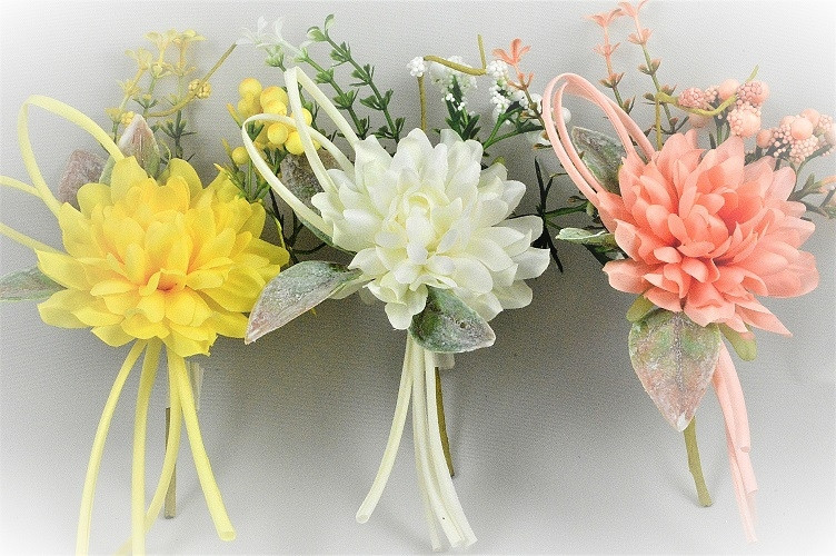 33003 - Spring floral arrangement with a curled soft ribbon embellishment.  Height  20cms ,  Width  11cms  (approx) 